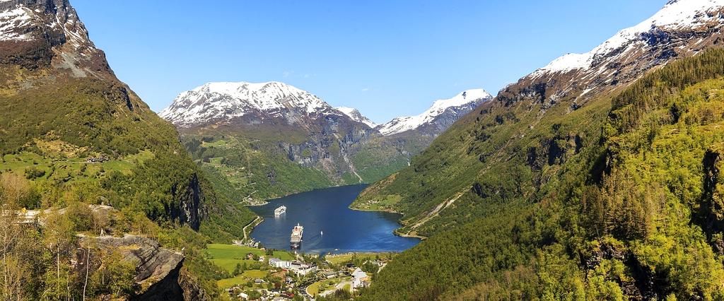 Panoramic view of Geirangerfjord in Norway with green mountains