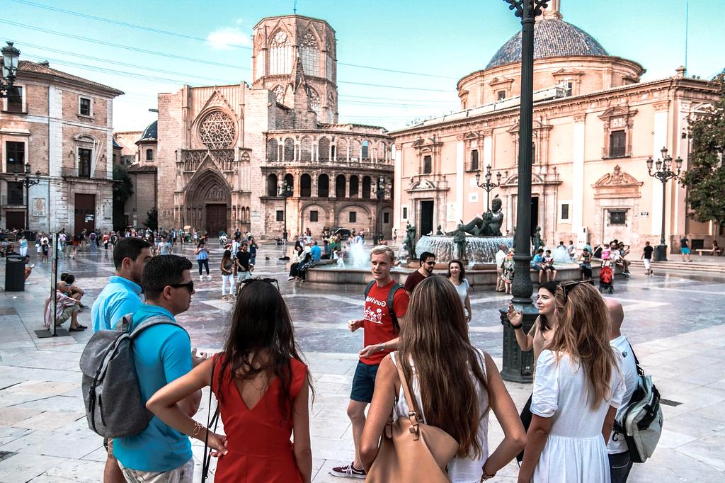 Professional guide showing a map to a group
