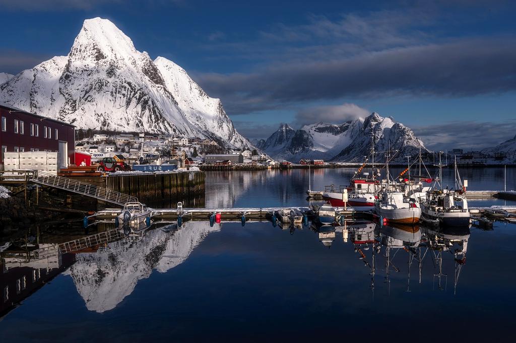 Fjord cruise ship passing through scenic waters